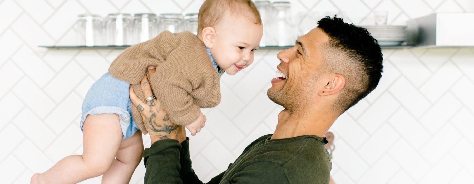 a man holding a baby