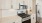 a kitchen with white cabinets